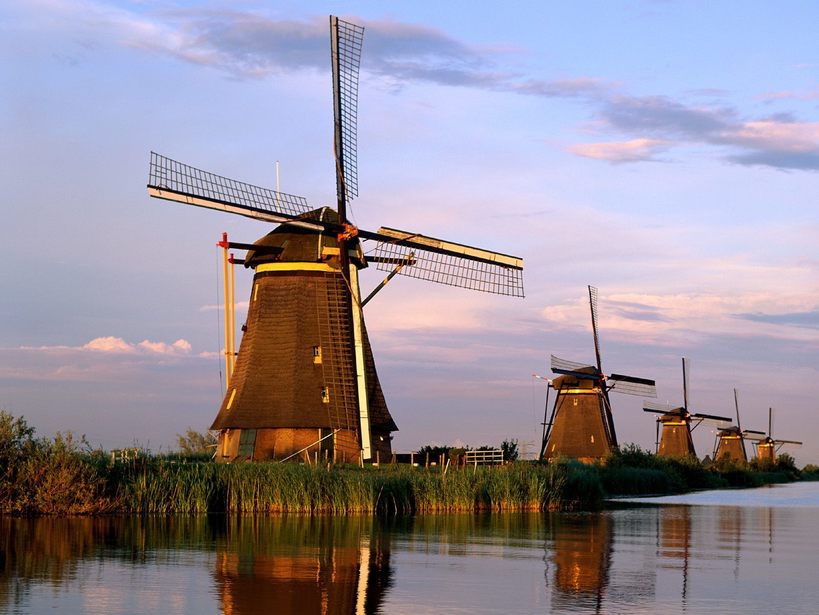 Eighteenth century windmills, once used to drain Holland’s fenlands (a type of marsh), are now a UNESCO World Heritage Site in the village of Kinderdijk, the Netherlands.